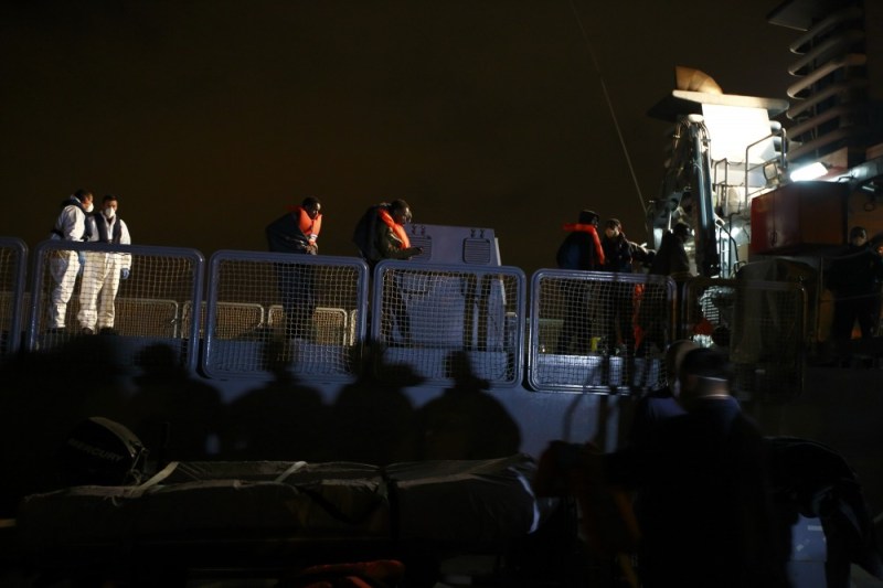 Migrants disembark from an Armed Forces of Malta (AFM) vessel at the AFM Maritime Squadron base at Haywharf in Valletta's Marsamxett Harbour, late March 20, 2014. 90 migrants claiming to be from Somalia were rescued by the AFM some 25 nautical miles off the Maltese islands when their boat ran into difficulties, according to army sources. REUTERS/Darrin Zammit Lupi (MALTA)