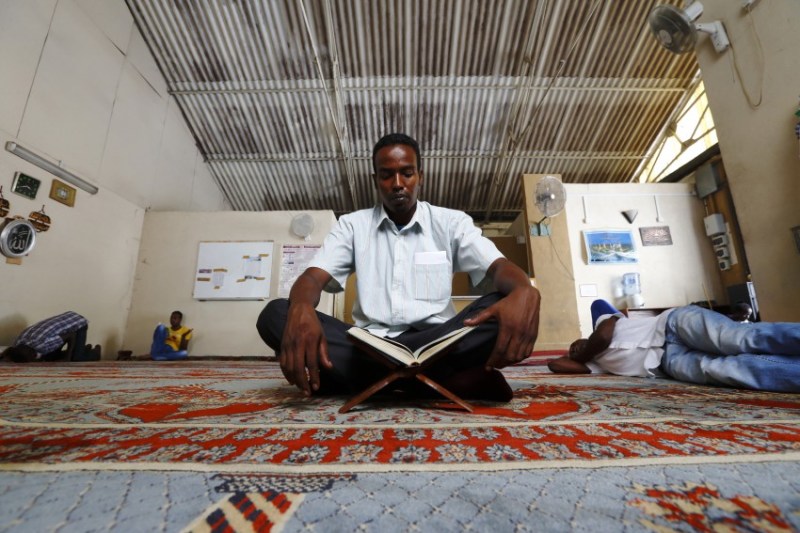 Mubarak Mahmud, a Somali asylum seeker, reads the Koran in the mosque at the Marsa Open Centre in Malta during Ramadan on August 2, 2013. The Marsa Open Centre houses around 500 male residents from 19 different countries in Sub-Saharan Africa. 